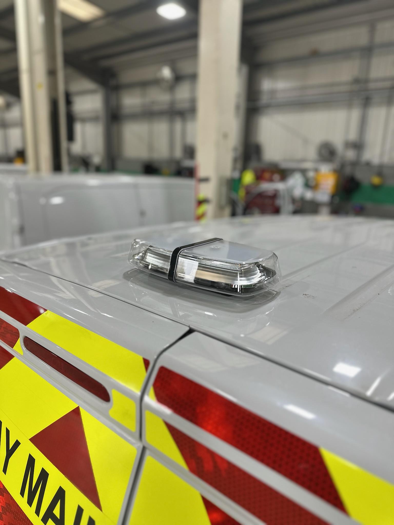 LED beacon mounted on roof of Chapter 8 highway maintenance van