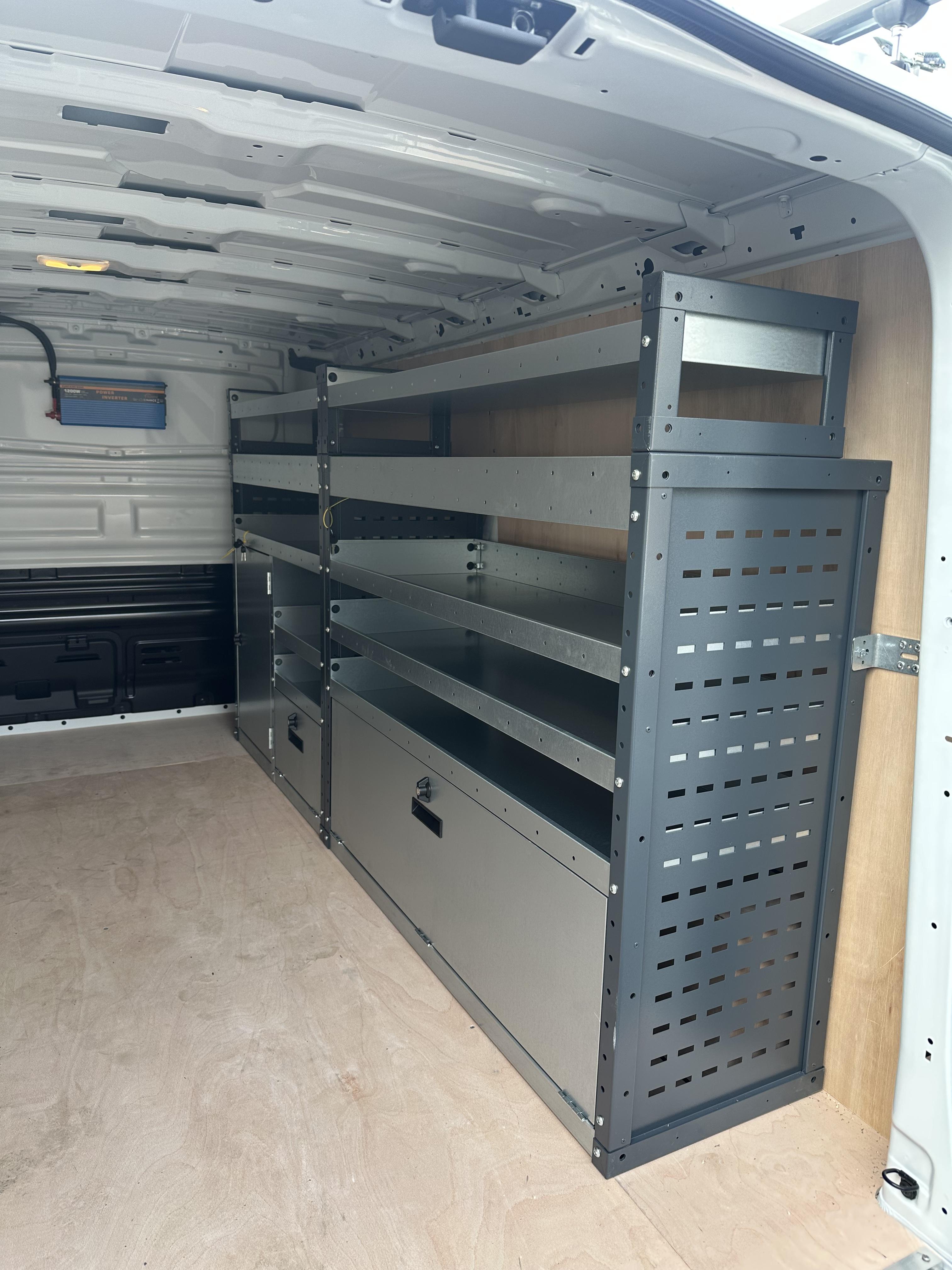 Heavy-duty metal racking with ply lining in large van