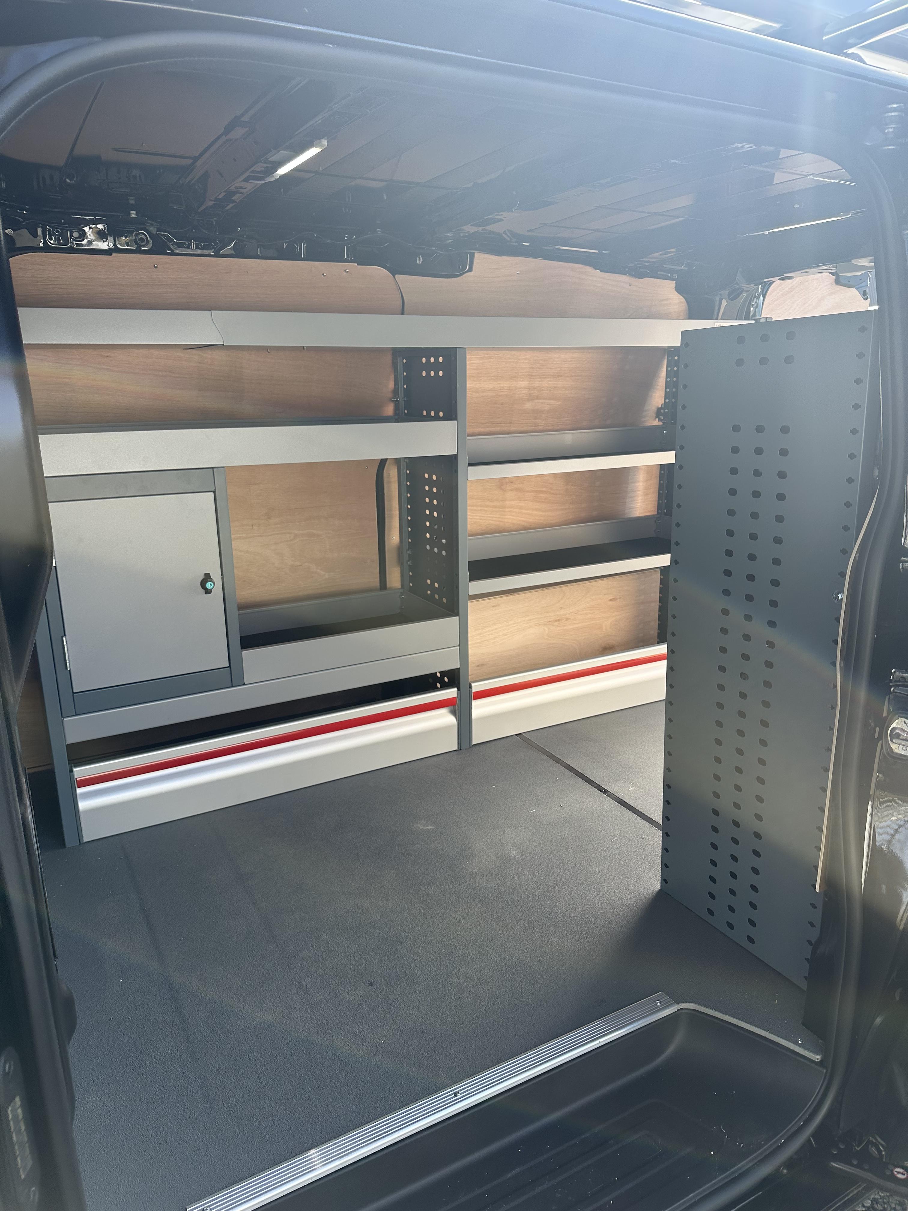 Metal racking system with ply shelving in van