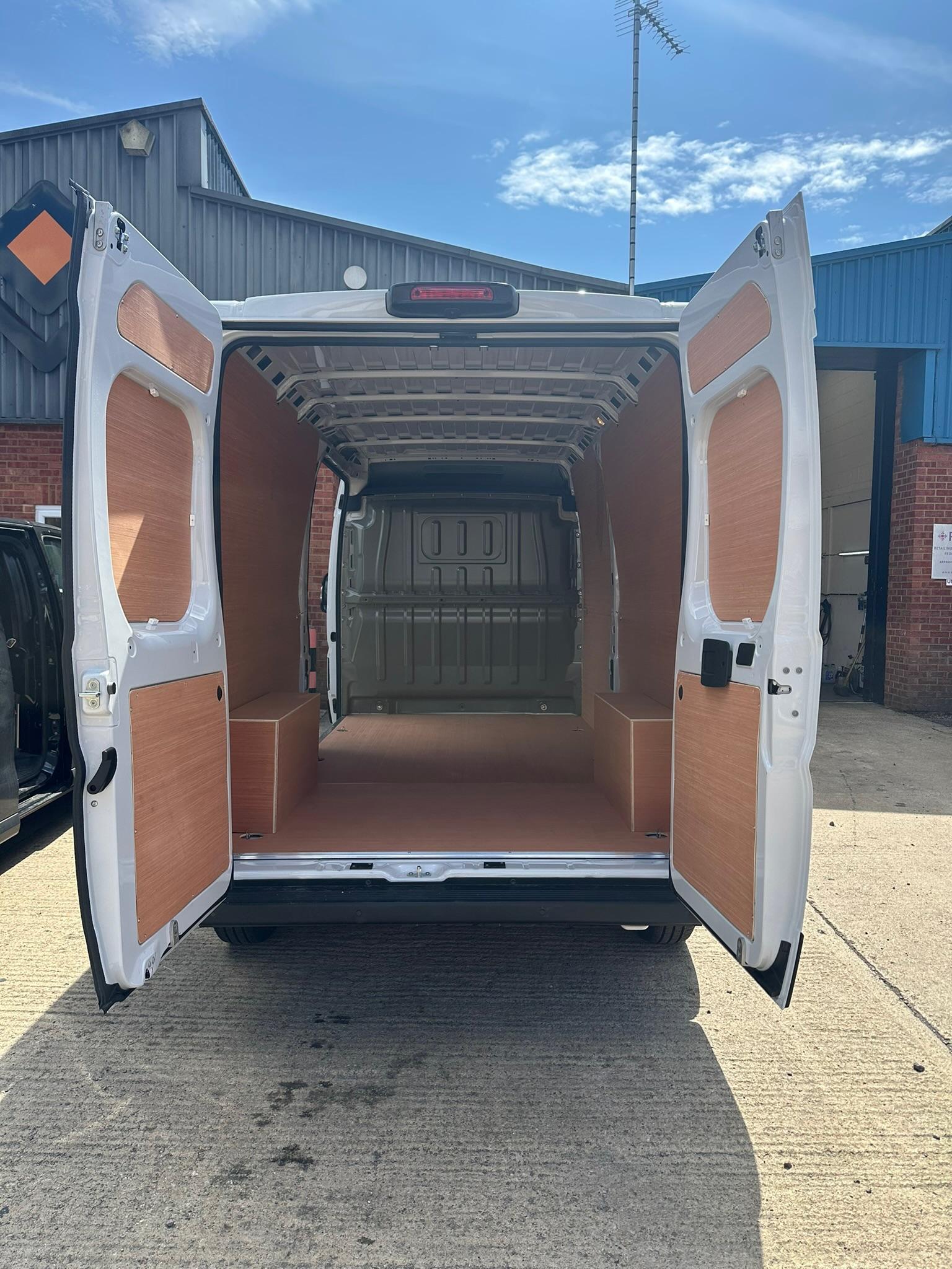 Full ply lining in large van viewed from rear doors