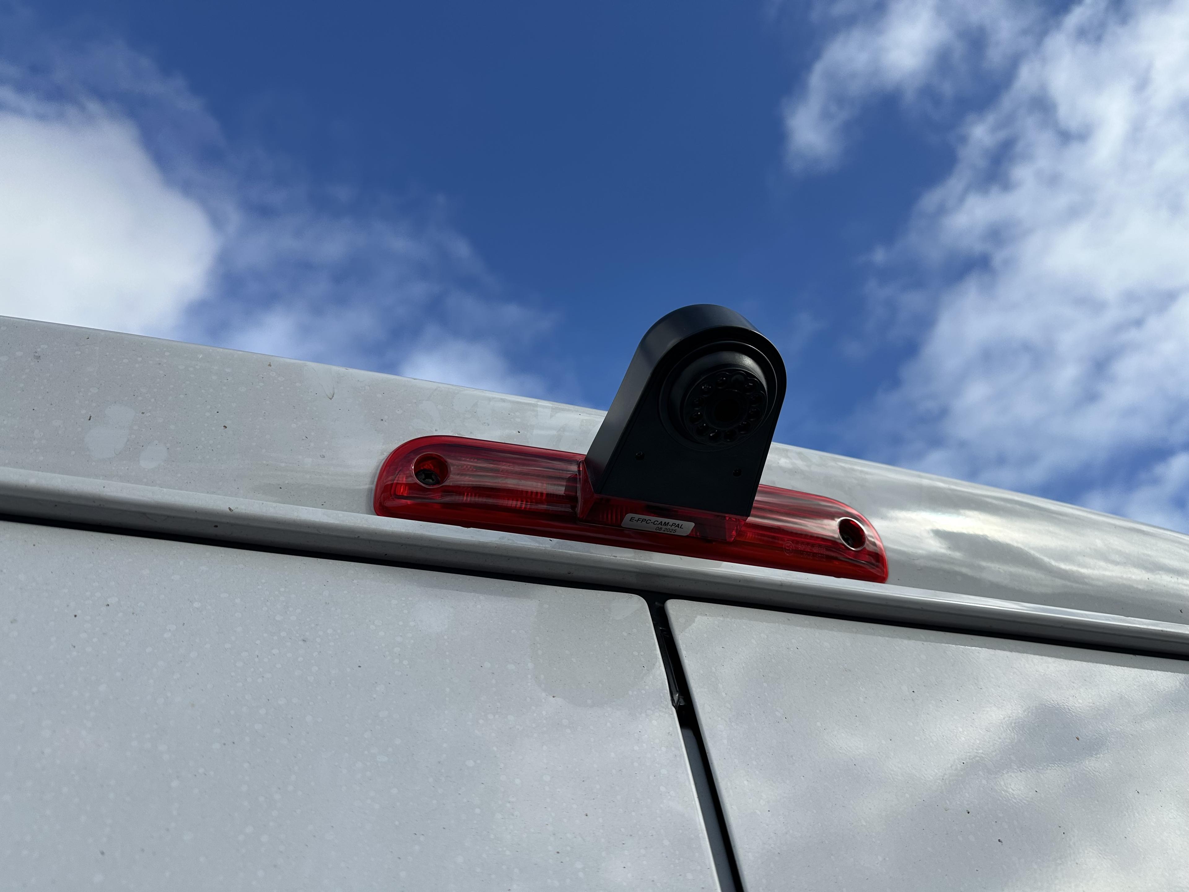 Reverse camera mounted on brake light housing