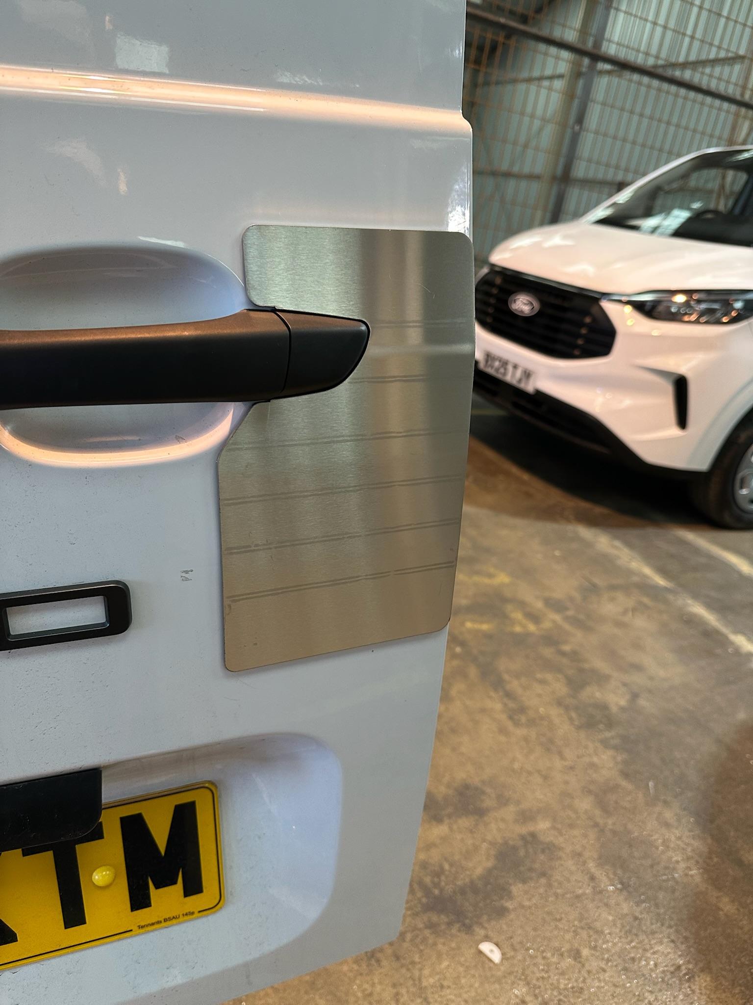 Stainless steel security plate fitted over Ford van door handle