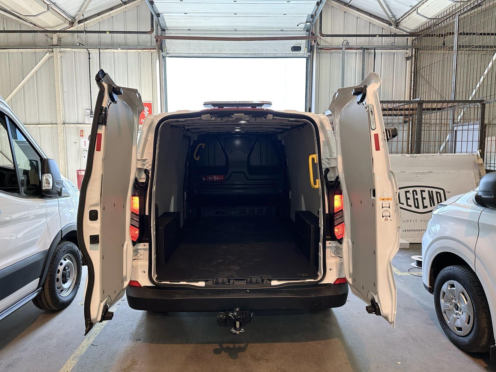 Towbar fitted to rear of van in workshop